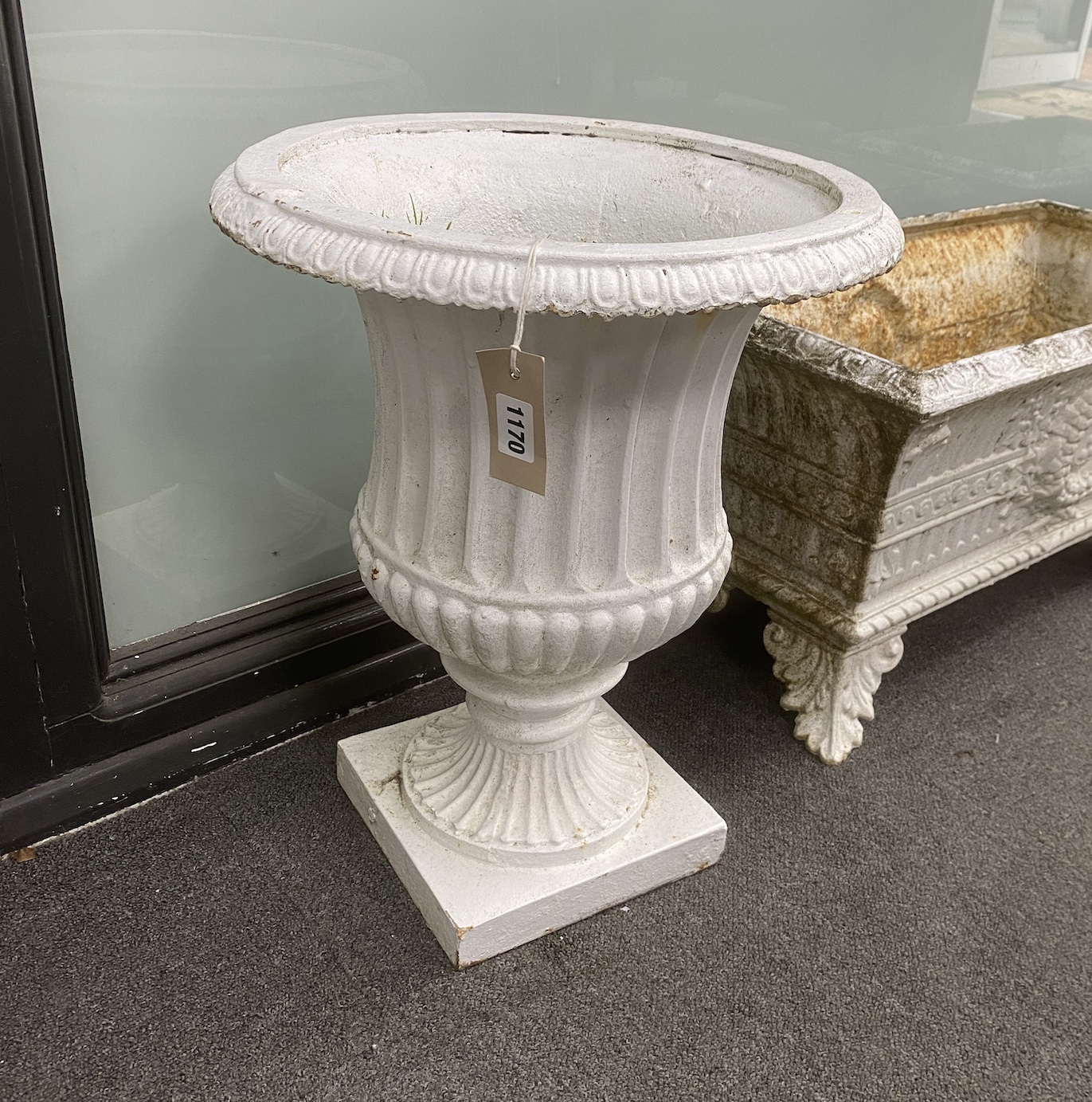 A pair of Victorian cast iron campana garden urns, diameter 40cm, height 50cm
